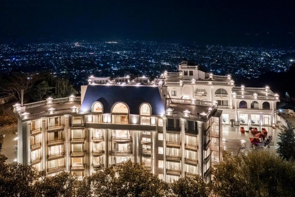 a night view of a building with lights at Pokhara Panorama Resort and Spa-Luxury Redefined in Pokhara