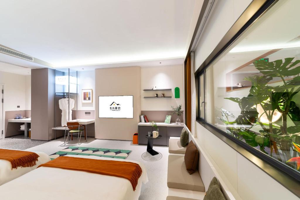 Postel nebo postele na pokoji v ubytování Vishan Keys Hotel 维尚潮宿