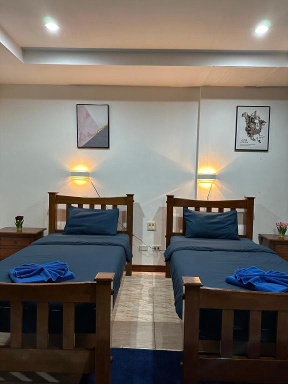 Postel nebo postele na pokoji v ubytování BT hotel Kata Beach