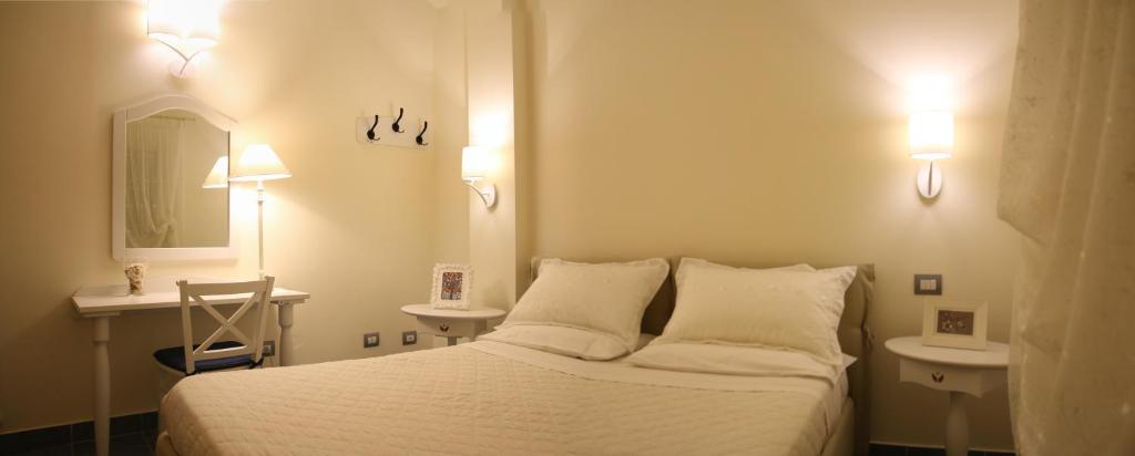 Posteľ alebo postele v izbe v ubytovaní Anthos Casa Vacanze