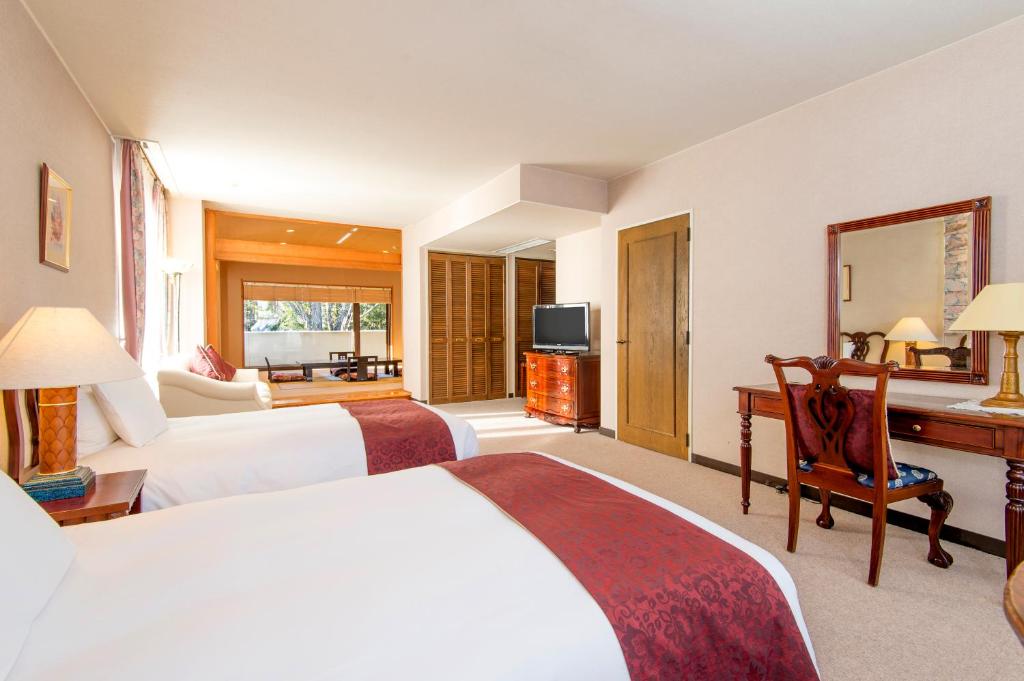 Postel nebo postele na pokoji v ubytování Hakuba Mominoki Hotel