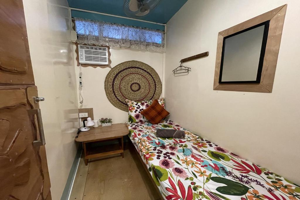 Postel nebo postele na pokoji v ubytování Balai Vivencio Hostel