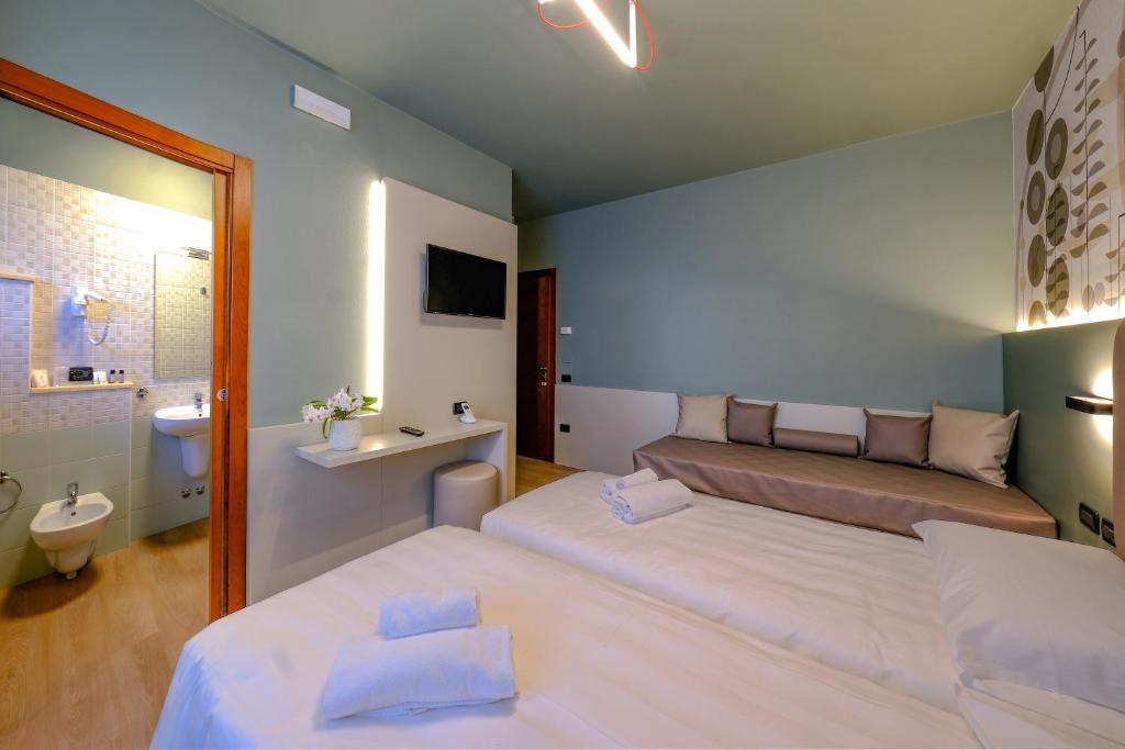 Postel nebo postele na pokoji v ubytování Villa Mimosa