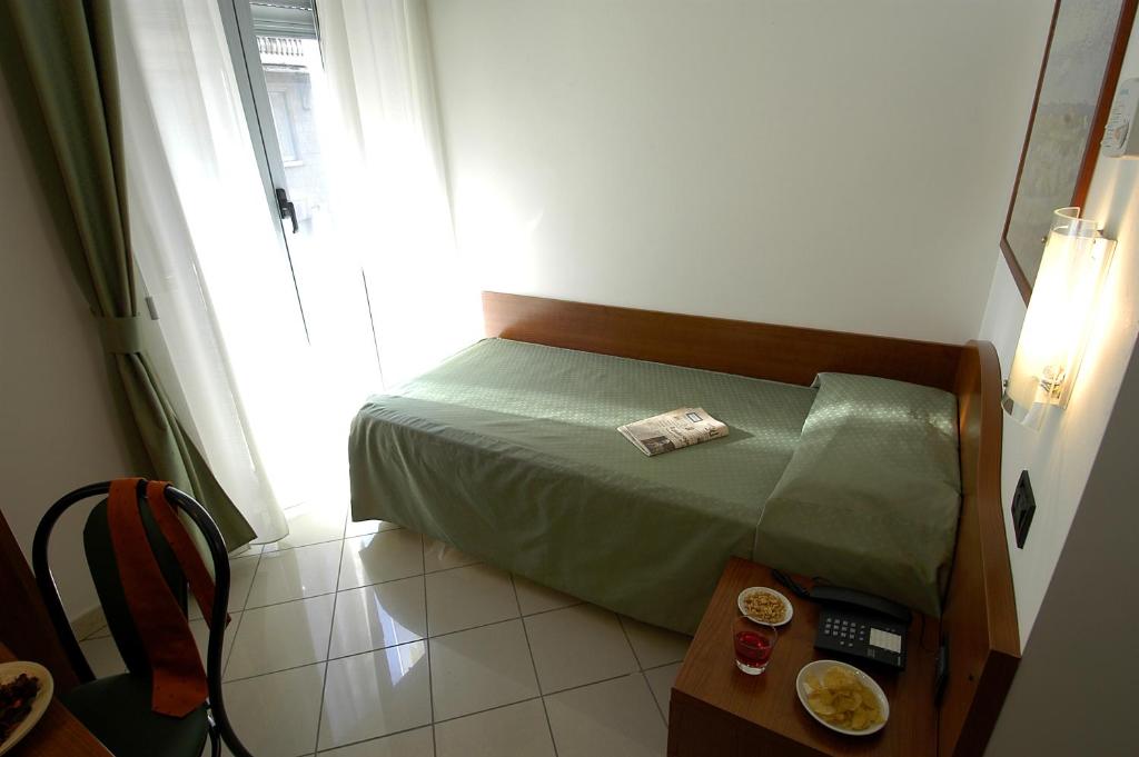Posteľ alebo postele v izbe v ubytovaní Hotel Dorè