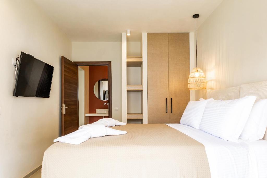 Postel nebo postele na pokoji v ubytování Hotel Mikros Paradisos