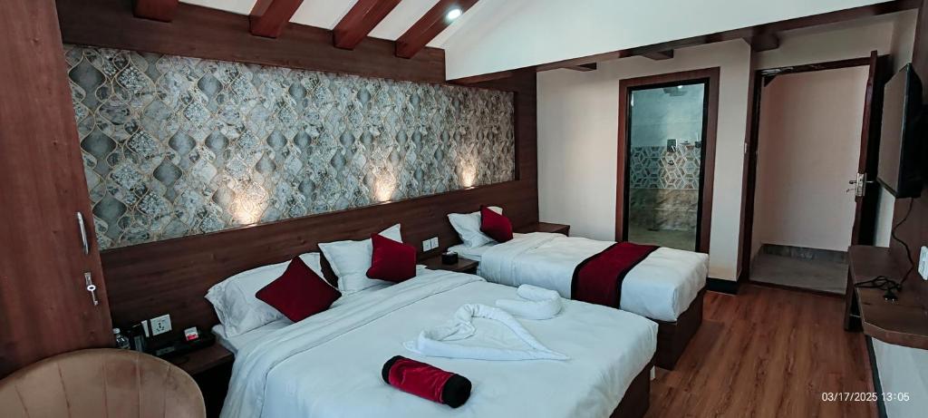 Postel nebo postele na pokoji v ubytování Lazimpat Boutique Hotel