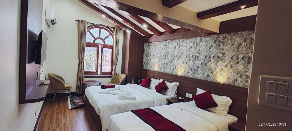 Postel nebo postele na pokoji v ubytování Lazimpat Boutique Hotel