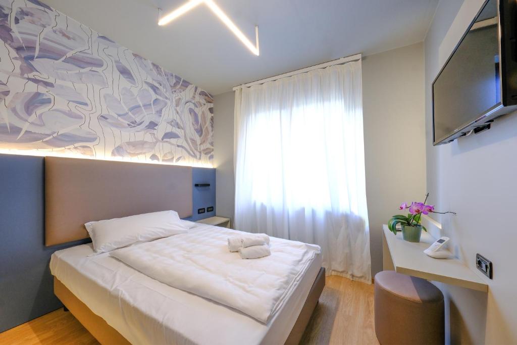 Postel nebo postele na pokoji v ubytování Villa Mimosa