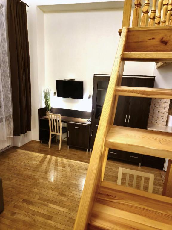 Televízia a/alebo spoločenská miestnosť v ubytovaní Safona - Pantheon Apartments
