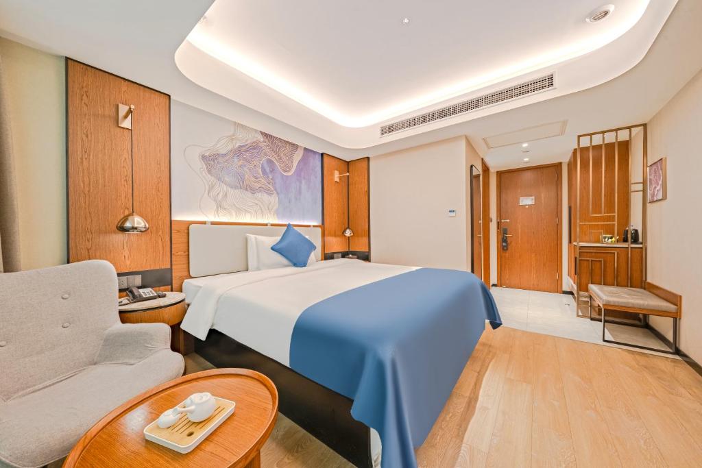 Postel nebo postele na pokoji v ubytování Yunfei Hotel - Shanghai Hongqiao Wuzhong Road Branch