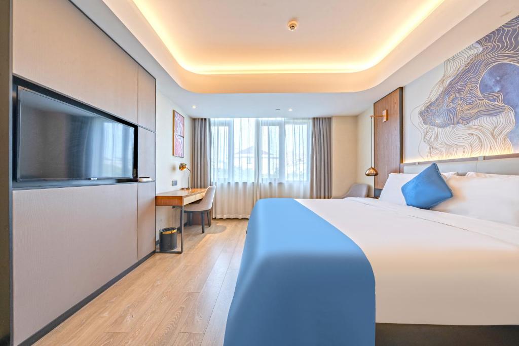 TV a/nebo společenská místnost v ubytování Yunfei Hotel - Shanghai Hongqiao Wuzhong Road Branch