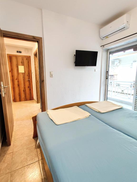 Postel nebo postele na pokoji v ubytování FLOGITA - 5 Beautiful Apartments