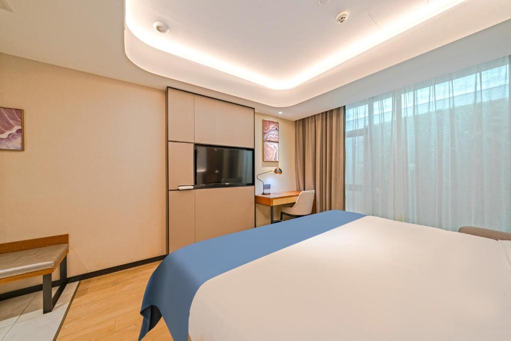TV a/nebo společenská místnost v ubytování Yunfei Hotel - Shanghai Hongqiao Wuzhong Road Branch