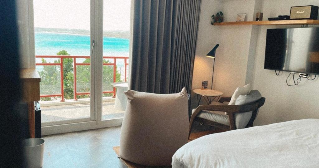 Rúm í herbergi á il Piccolo Polpo Hotel