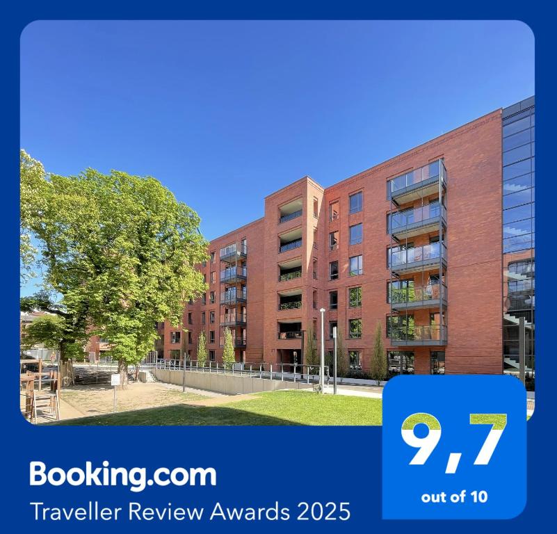 Hotel SCALA City Center Premium Apartments & Parking #Gdańsk by Acznowy, an image of a building with a sign that at SCALA City Center Premium Apartments & Parking #Gdańsk by Acznowy in Gdańsk