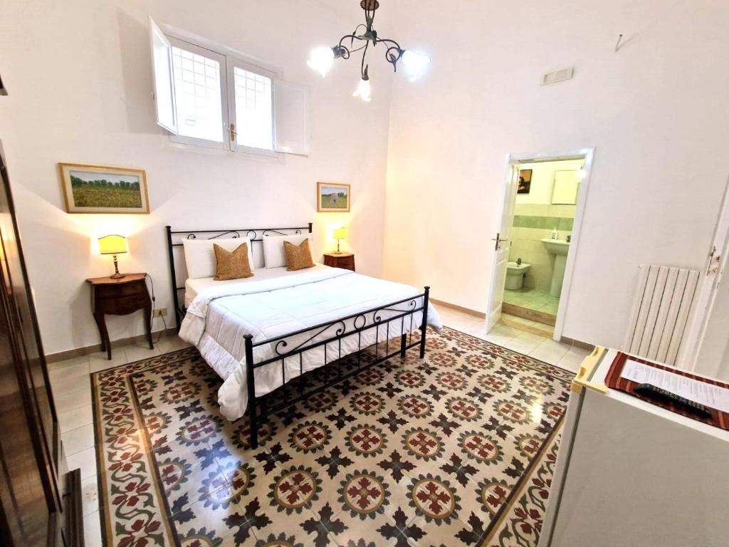 Postel nebo postele na pokoji v ubytování BnB '900 Lecce centro