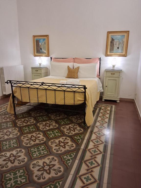 Postel nebo postele na pokoji v ubytování BnB '900 Lecce centro