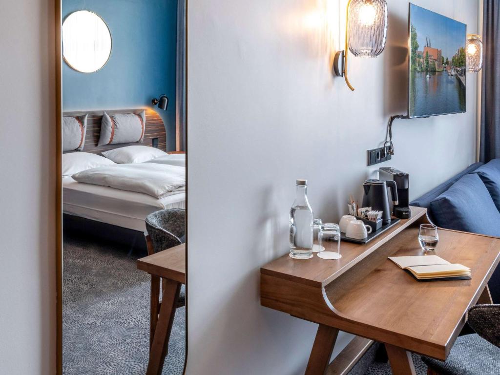 Postel nebo postele na pokoji v ubytování Mercure Hotel Luebeck City Center