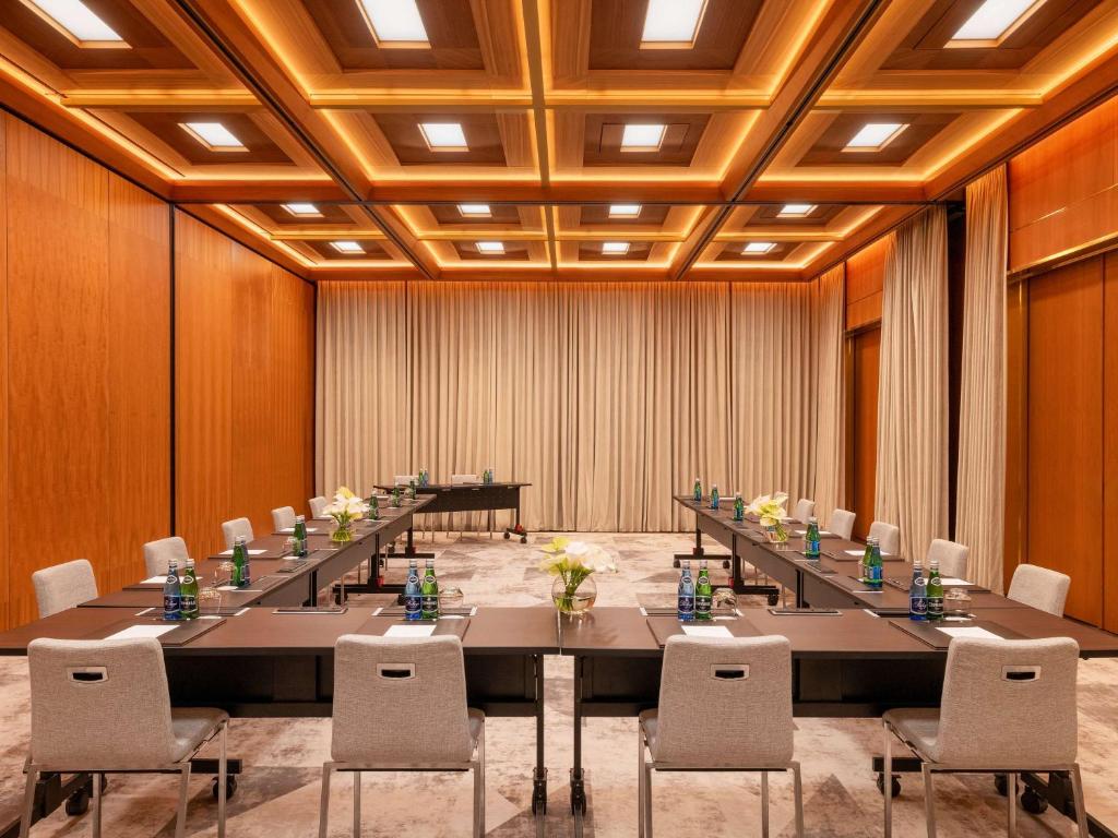 a large conference room with a long table and chairs at Raffles Europejski Warsaw in Warsaw