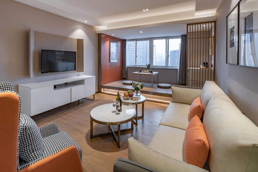 TV a/nebo společenská místnost v ubytování Chongqing Liangjiang New District Yunxi Hotel