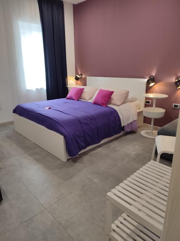 Postel nebo postele na pokoji v ubytování B&B CaselloA Suites
