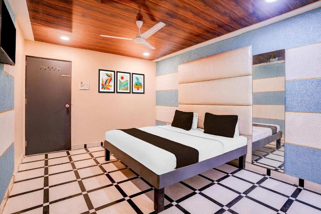 Postel nebo postele na pokoji v ubytování Super Hotel O Palava Dombivali