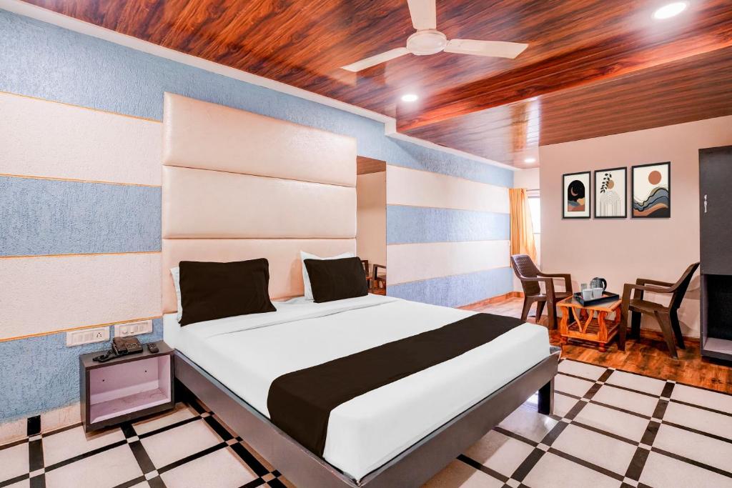 Postel nebo postele na pokoji v ubytování Super Hotel O Palava Dombivali