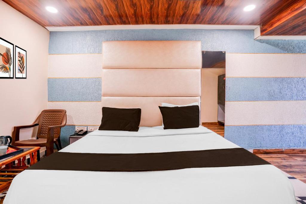 Postel nebo postele na pokoji v ubytování Super Hotel O Palava Dombivali