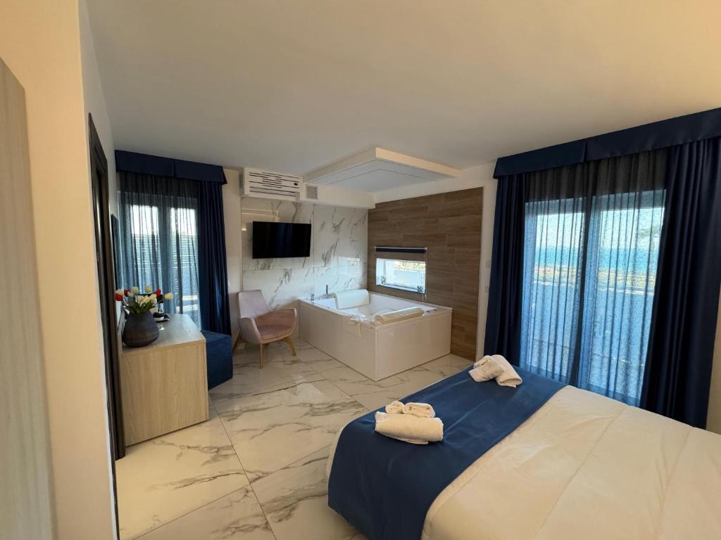 Postel nebo postele na pokoji v ubytování Hotel Cocceio