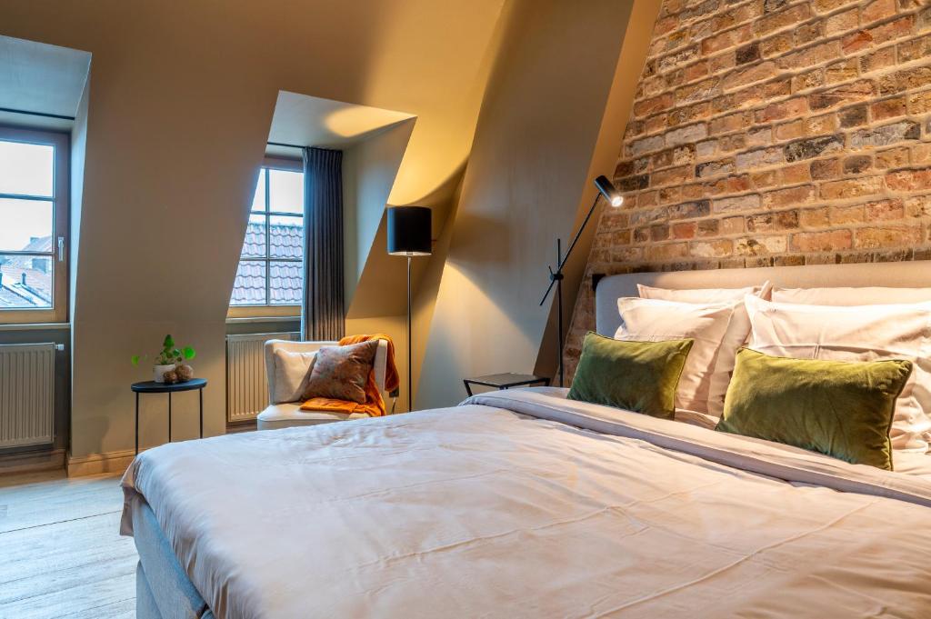 Postel nebo postele na pokoji v ubytování Guestsuite Couvert
