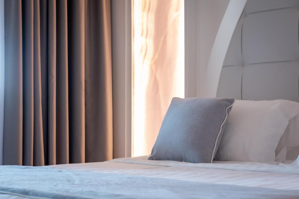 Postel nebo postele na pokoji v ubytování DIAMOND SUITE