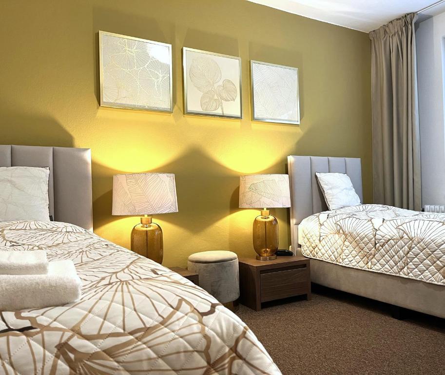Postel nebo postele na pokoji v ubytování Hotel Zlatý Býk