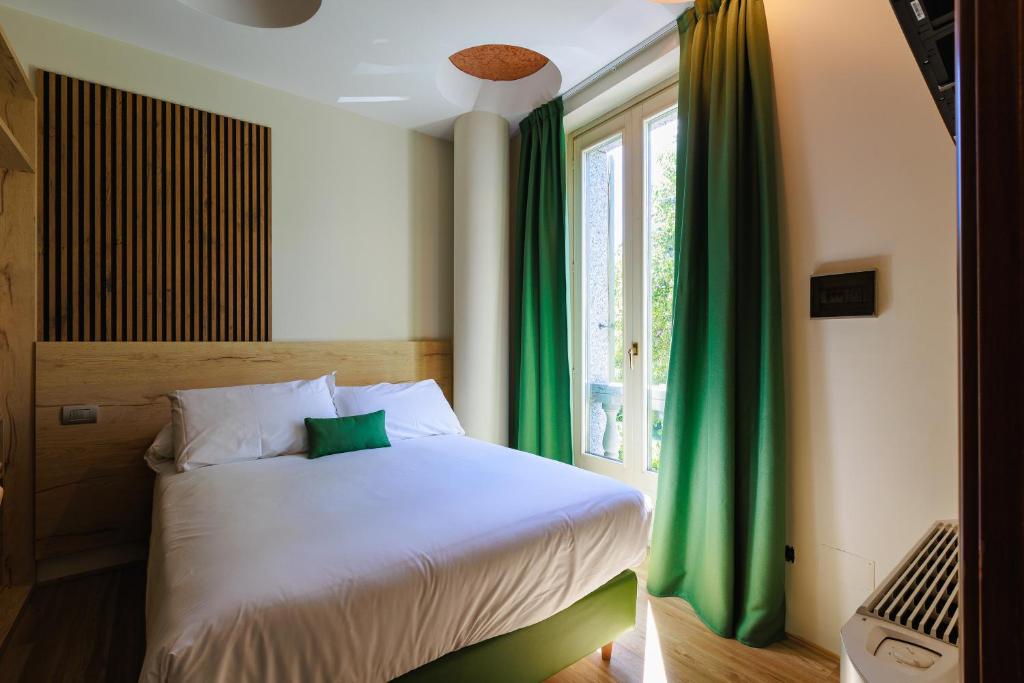 Postel nebo postele na pokoji v ubytování Botanique Hotel Vergani