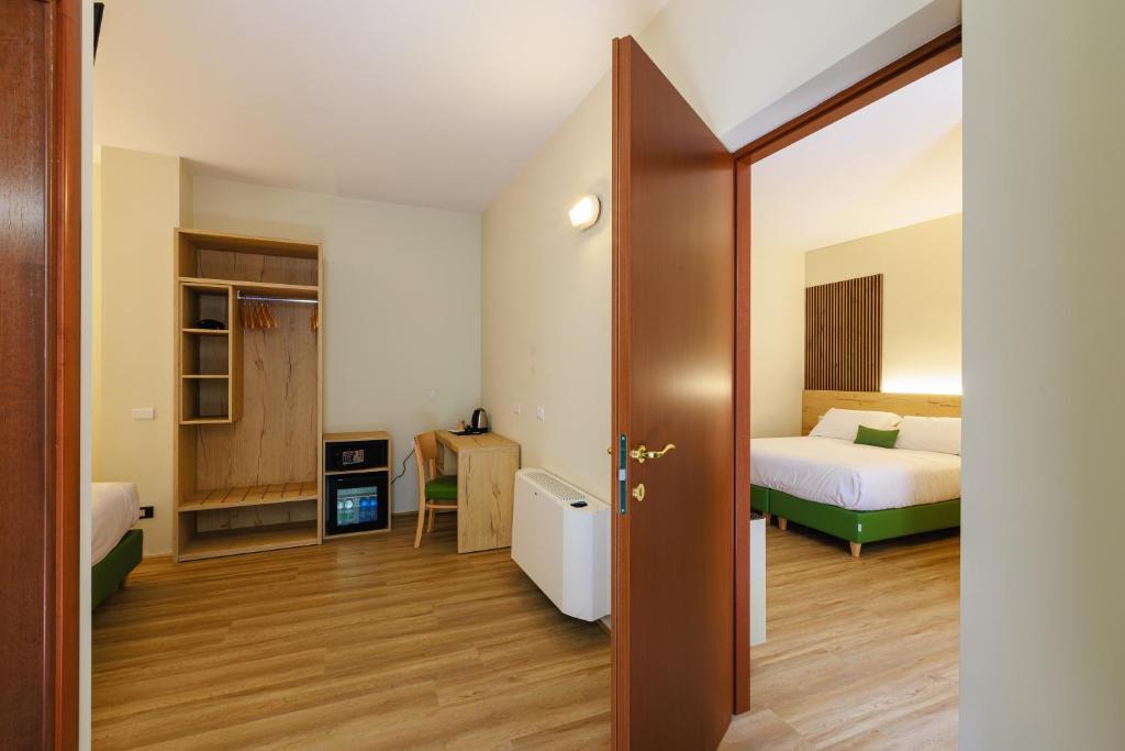 Postel nebo postele na pokoji v ubytování Botanique Hotel Vergani