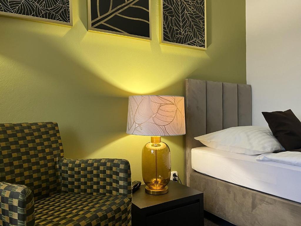 Postel nebo postele na pokoji v ubytování Hotel Zlatý Býk
