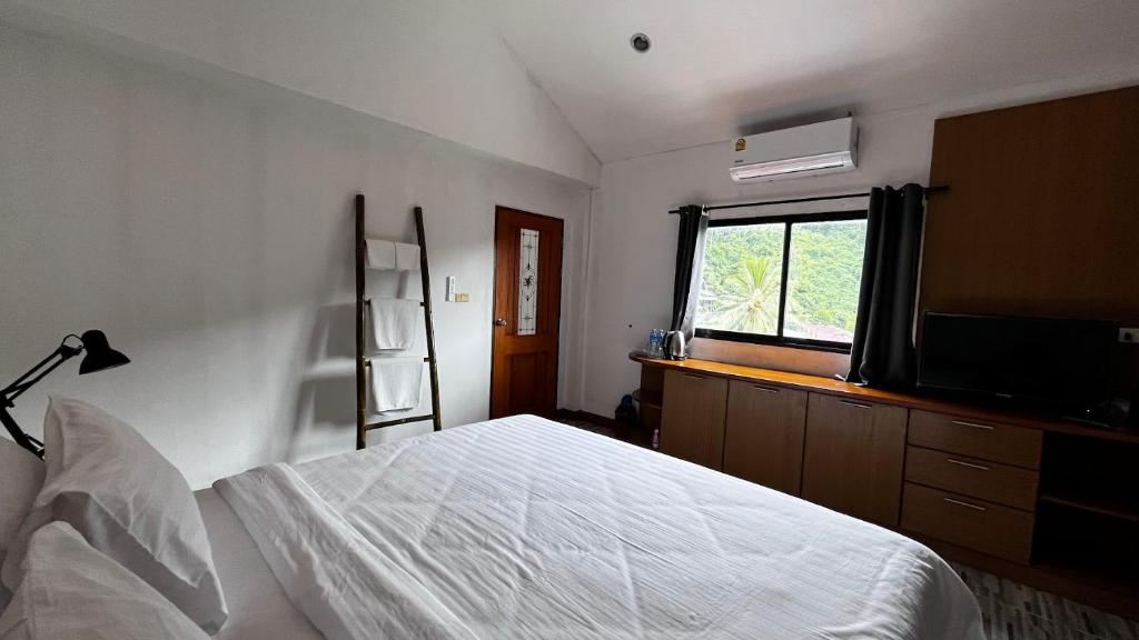 Postel nebo postele na pokoji v ubytování Coco Mountain View Guest House Hotel
