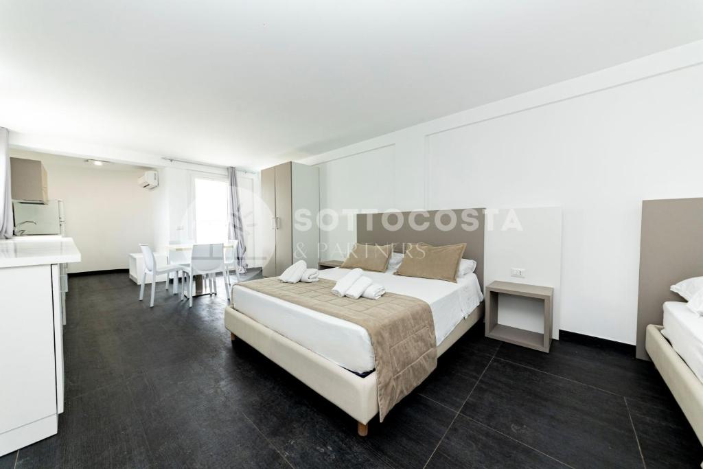 Łóżko lub łóżka w pokoju w obiekcie Ungaretti Resort