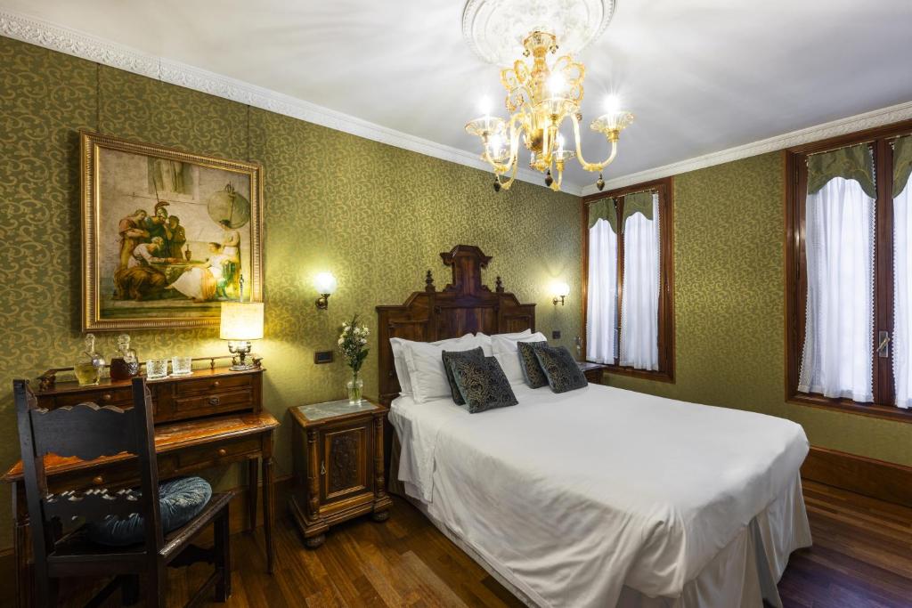 Postel nebo postele na pokoji v ubytování Hotel Casa Nicolò Priuli