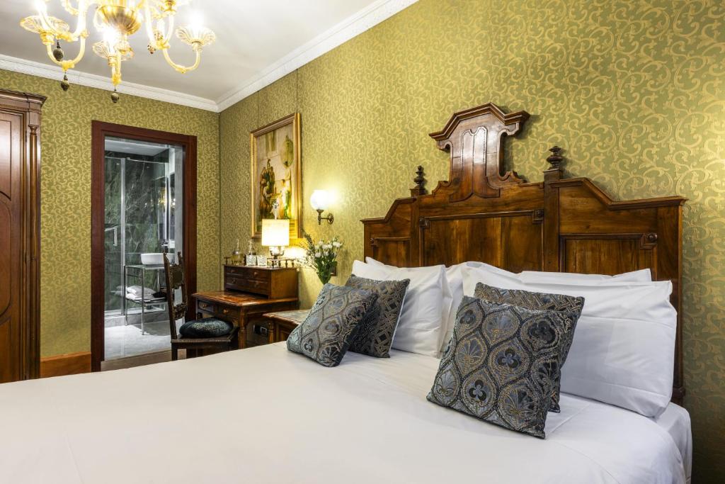 Postel nebo postele na pokoji v ubytování Hotel Casa Nicolò Priuli