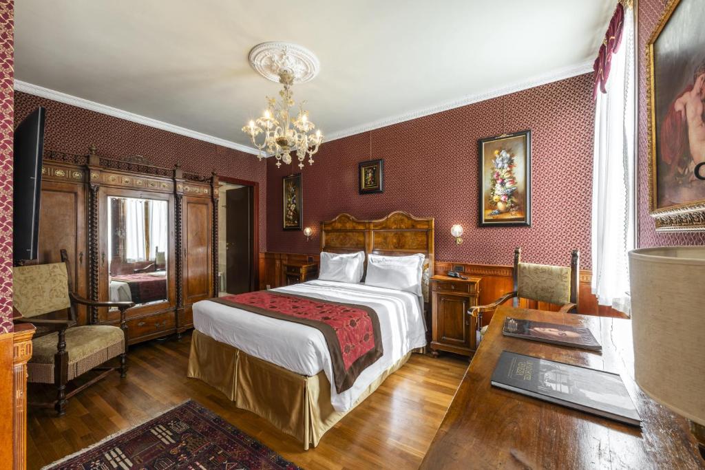 Postel nebo postele na pokoji v ubytování Hotel Casa Nicolò Priuli