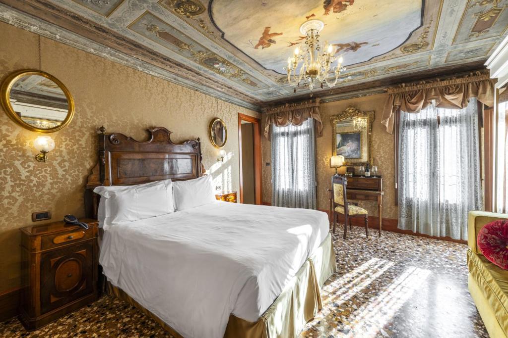 Postel nebo postele na pokoji v ubytování Hotel Casa Nicolò Priuli
