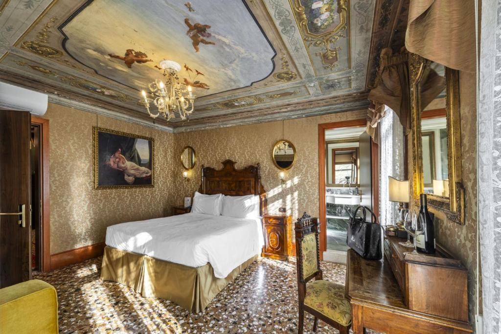 Postel nebo postele na pokoji v ubytování Hotel Casa Nicolò Priuli