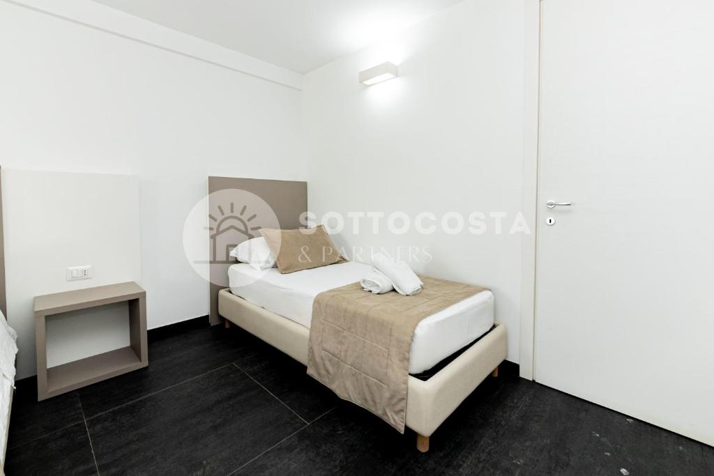 Łóżko lub łóżka w pokoju w obiekcie Ungaretti Resort