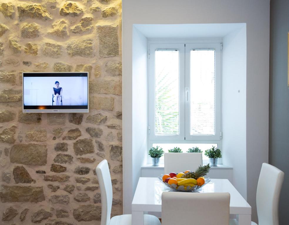 TV a/nebo společenská místnost v ubytování Casa Arancia