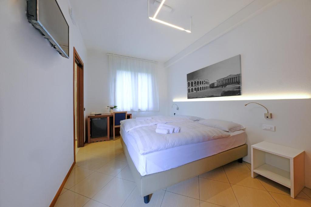 Postel nebo postele na pokoji v ubytování Villa Mimosa