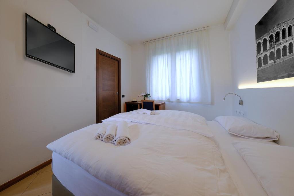 Postel nebo postele na pokoji v ubytování Villa Mimosa