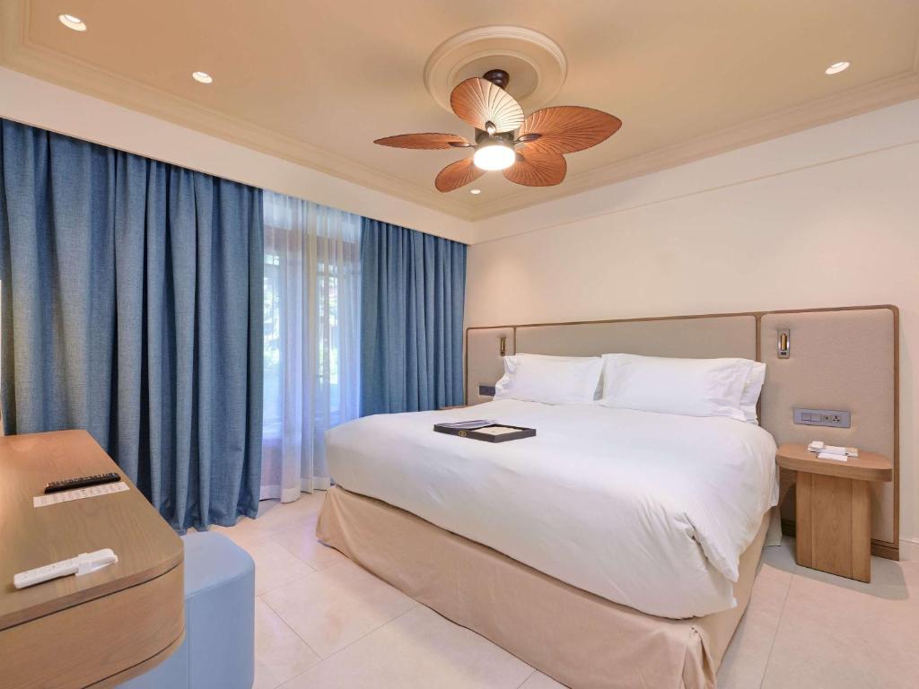 Postel nebo postele na pokoji v ubytování Sofitel Mauritius L'Imperial Resort & Spa