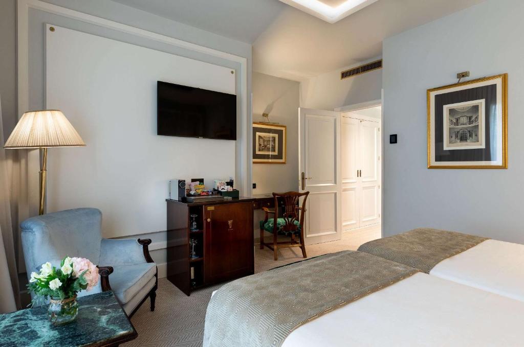Postel nebo postele na pokoji v ubytování Wellington Hotel & Spa Madrid