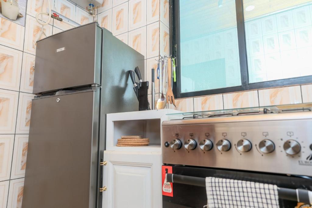 Kuchyň nebo kuchyňský kout v ubytování T-Square Residence Makepe