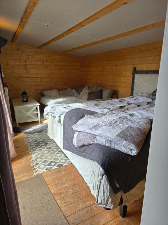 Postel nebo postele na pokoji v ubytování Tiny house Söderåsen